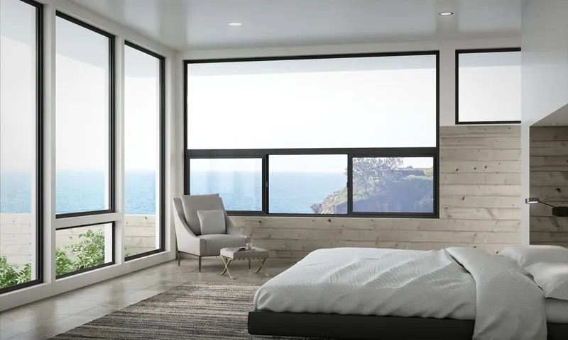 Slim dark aluminum frames wrapping a corner in a modern bedroom