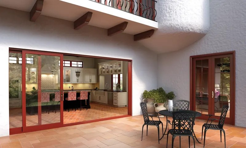 A Milgard moving glass wall pocketed fully open onto a covered patio