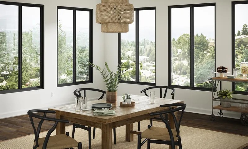 Slim black Trinsic frames wrapping a dining room corner