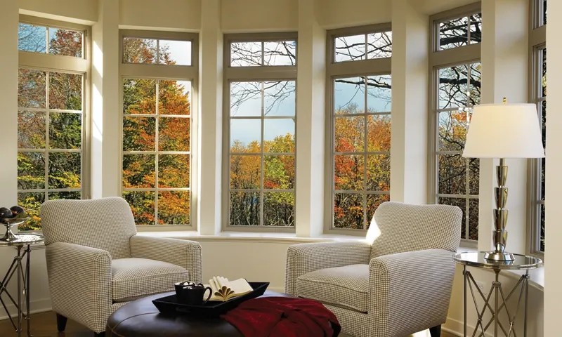 A Tuscany bay window with colonial grids in a sitting room